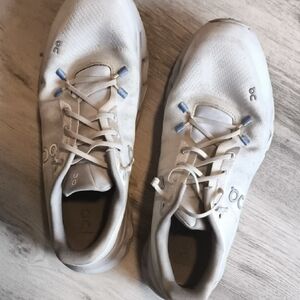 On Running White Shoes with Blue Highlights